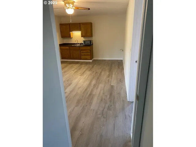 a view of a living room with a flat screen tv