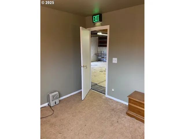 a view of a livingroom with table and chair