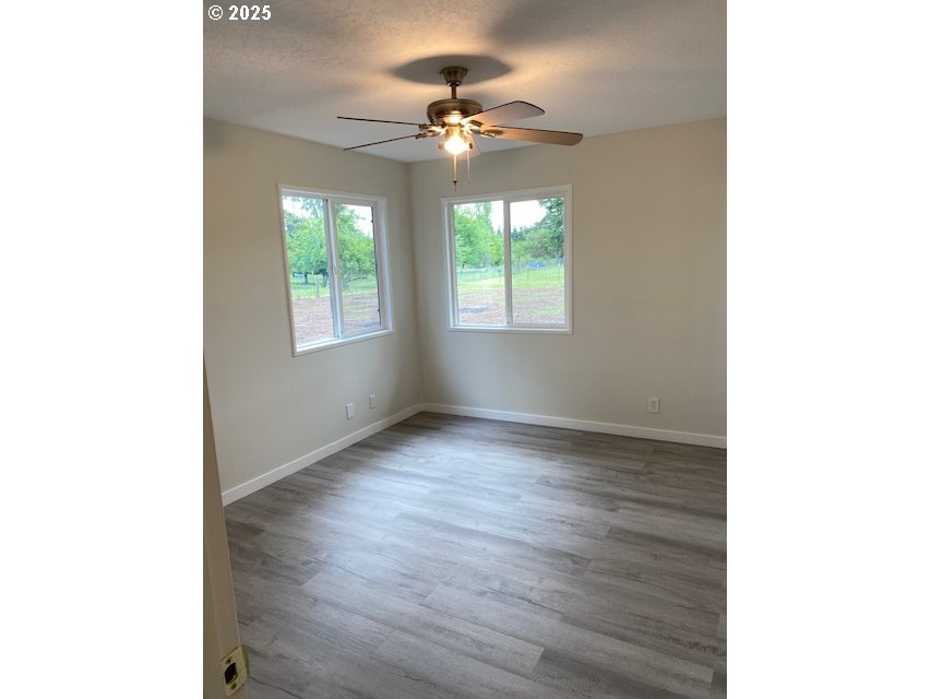 82277 Davisson Road Creswell, OR 97426 - Photo 8 of 48 a view of a livingroom with a window and a ceiling fan
