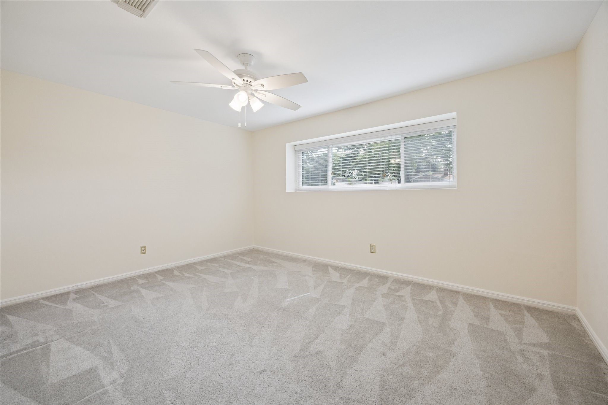 10050 Locke Lane Houston, TX 77042 - Photo 19 of 31 an empty room with a fan & a window