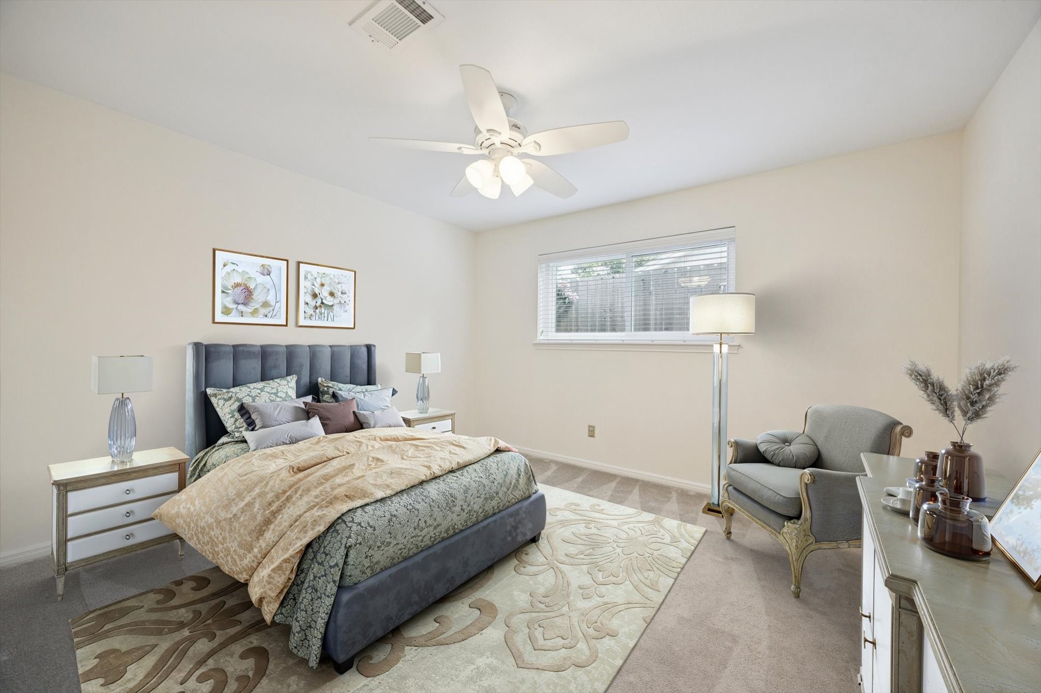 10050 Locke Lane Houston, TX 77042 - Photo 22 of 31 a bedroom with a bed and ceiling fan