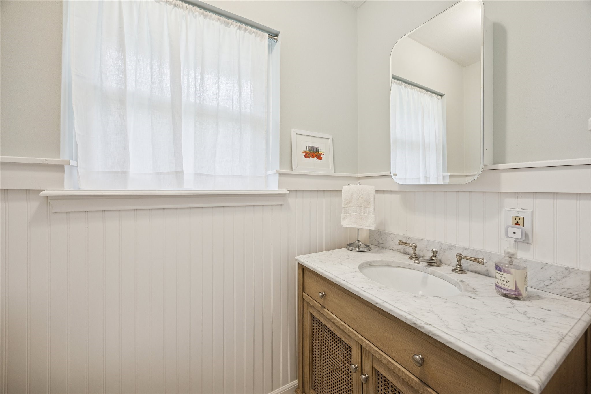 10050 Locke Lane Houston, TX 77042 - Photo 23 of 31 a bathroom with a sink and a mirror