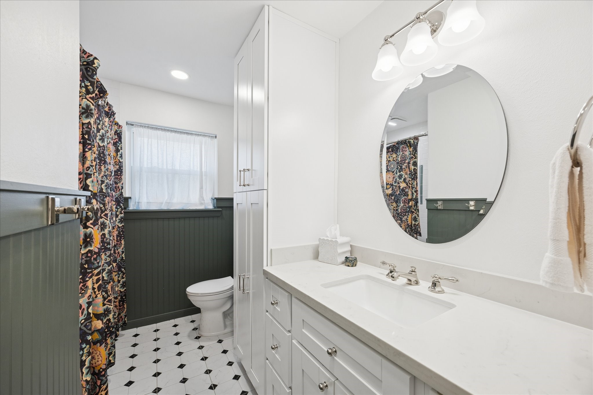 10050 Locke Lane Houston, TX 77042 - Photo 24 of 31 a bathroom with a sink mirror and toilet