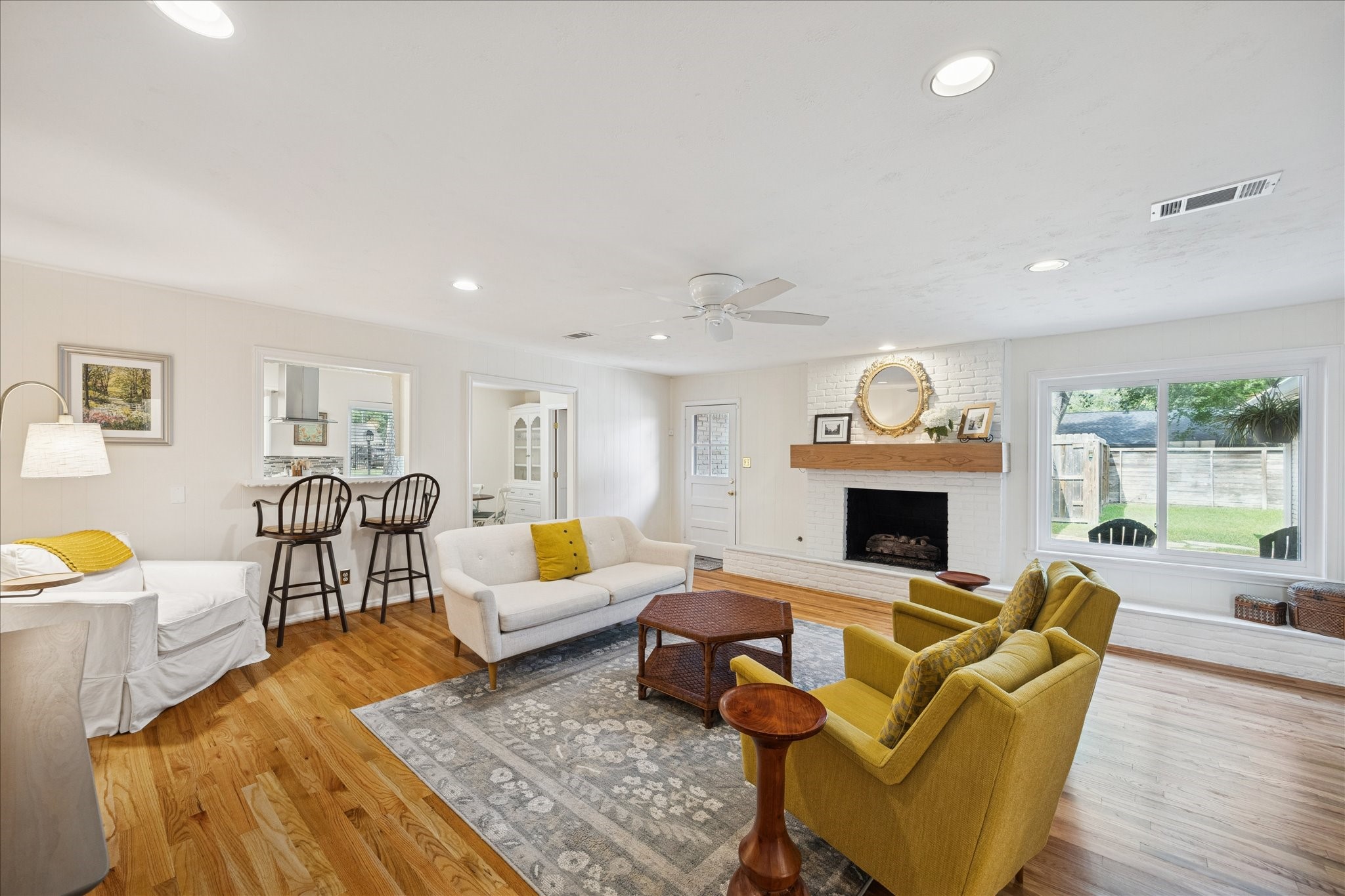 10050 Locke Lane Houston, TX 77042 - Photo 5 of 31 a living room with furniture a fireplace and a table