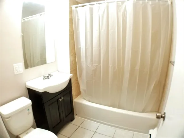 a bathroom with a bathtub sink and toilet