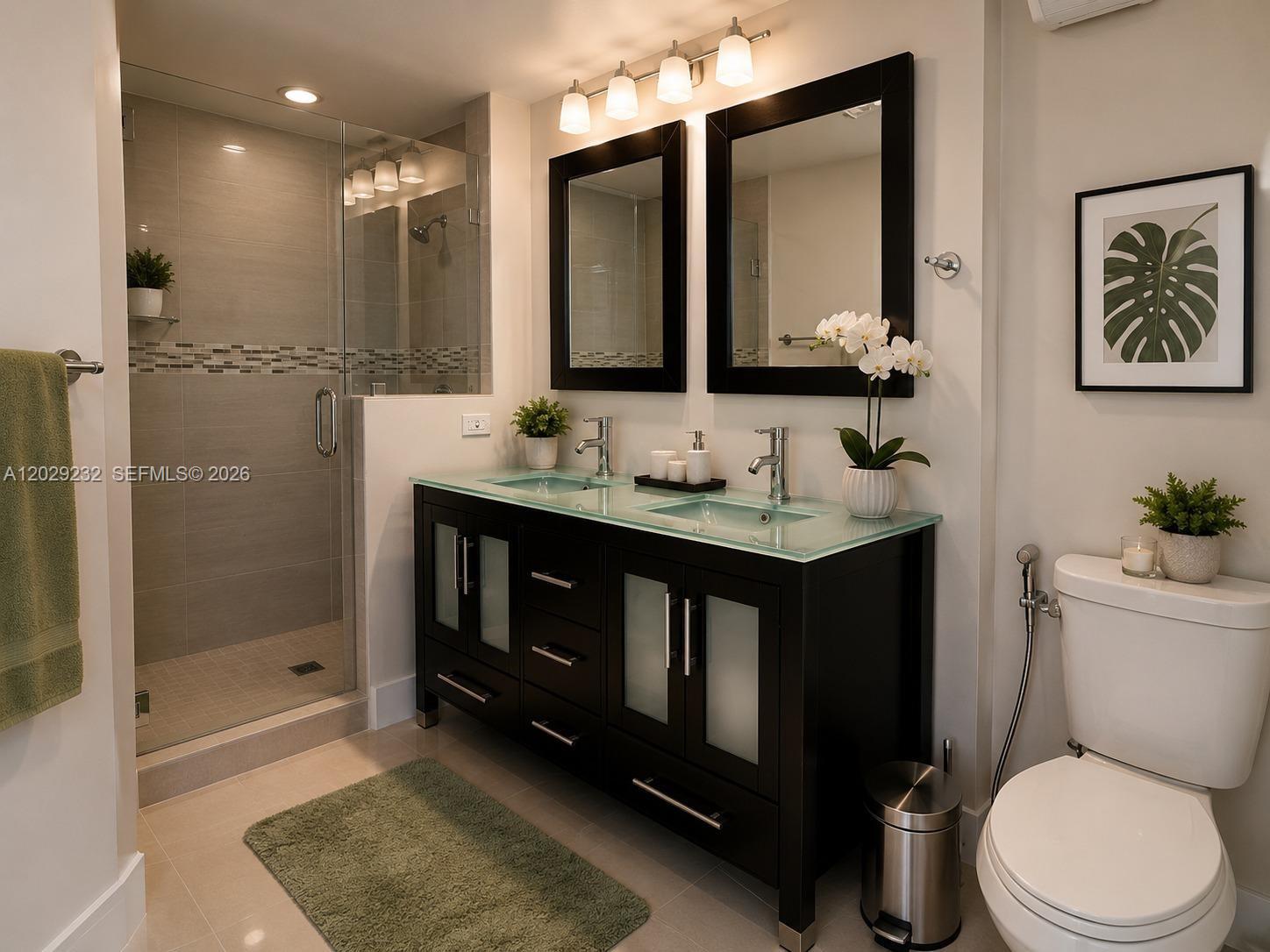 17100 North Bay Road, Unit 1605 Sunny Isles Beach, FL 33160 - Photo 22 of 52 a bathroom with a sink vanity granite toilet and a mirror
