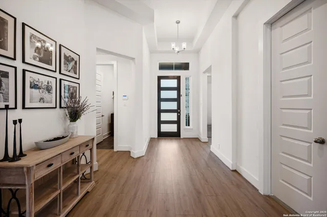a view of an entryway with wooden floor