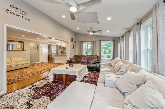 a living room with furniture window and a table