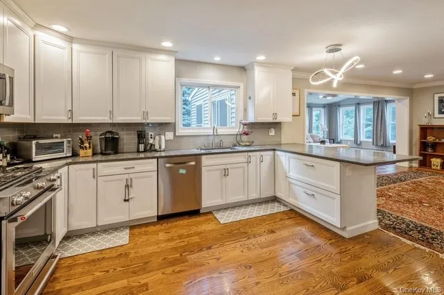 a kitchen with a sink stove and cabinets