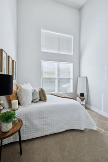 a bedroom with furniture and window