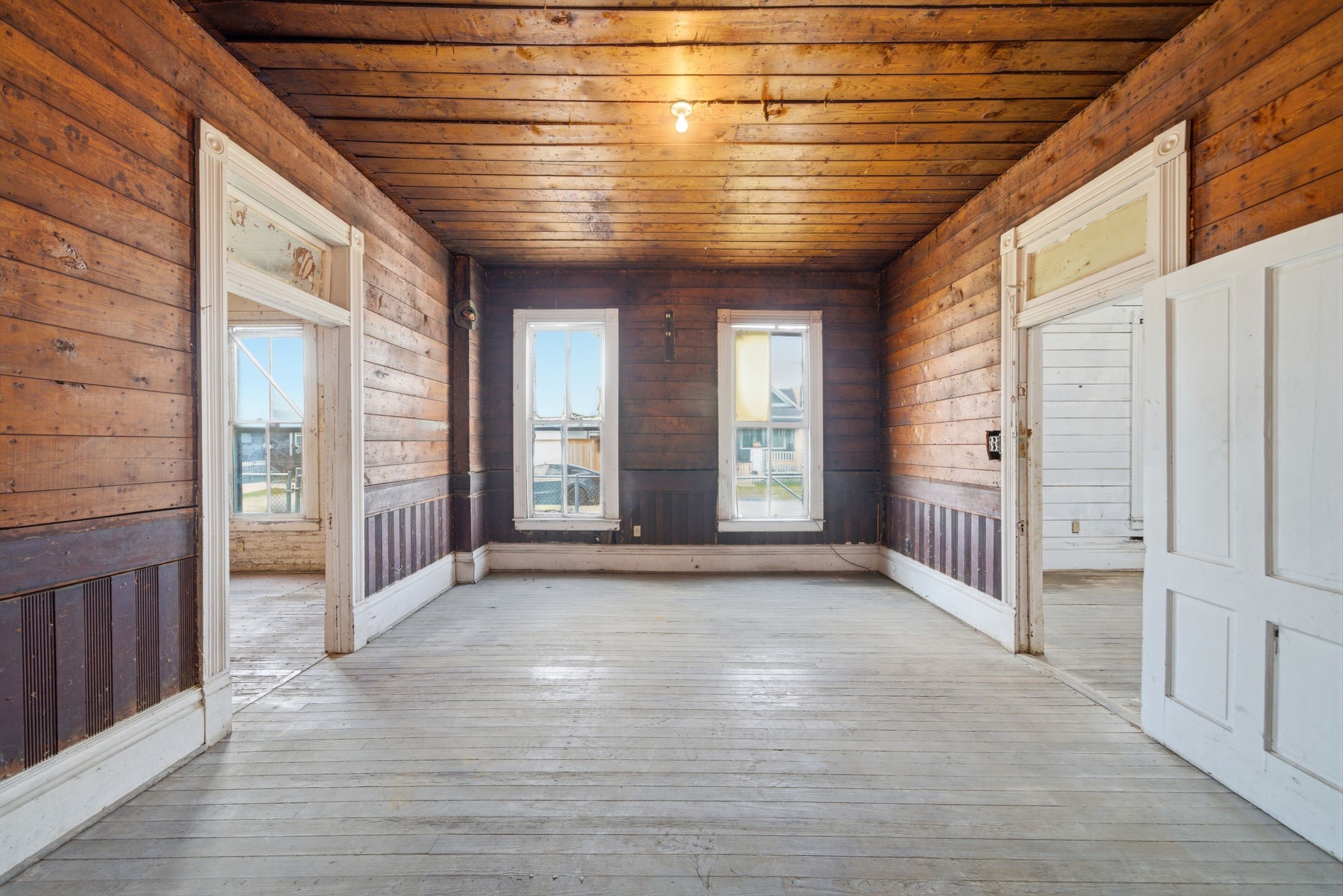 2023 Everett Street Houston, TX 77009 - Photo 15 of 25 Room 3 - this room has shiplap and wainscoting!! Again, transoms above the connecting doors! All transom hardware intact too!