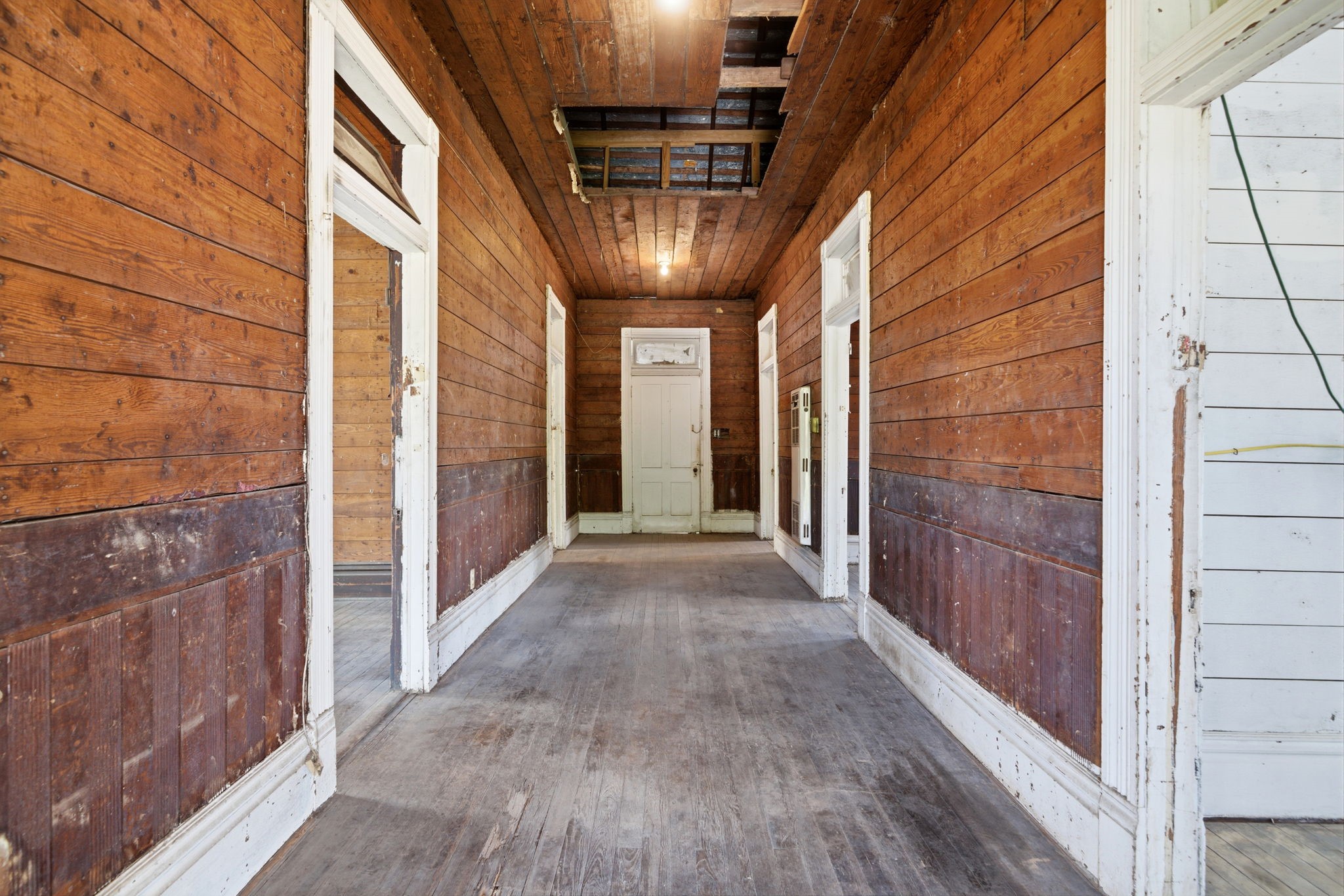 2023 Everett Street Houston, TX 77009 - Photo 7 of 25 Step into home and just look at the WIDE HALLWAY!! Plenty of room for art, furniture! TALL 11' ceilings (even taller ceilings in the attic, possibly convert into living space!). SOLID WOOD floors!!