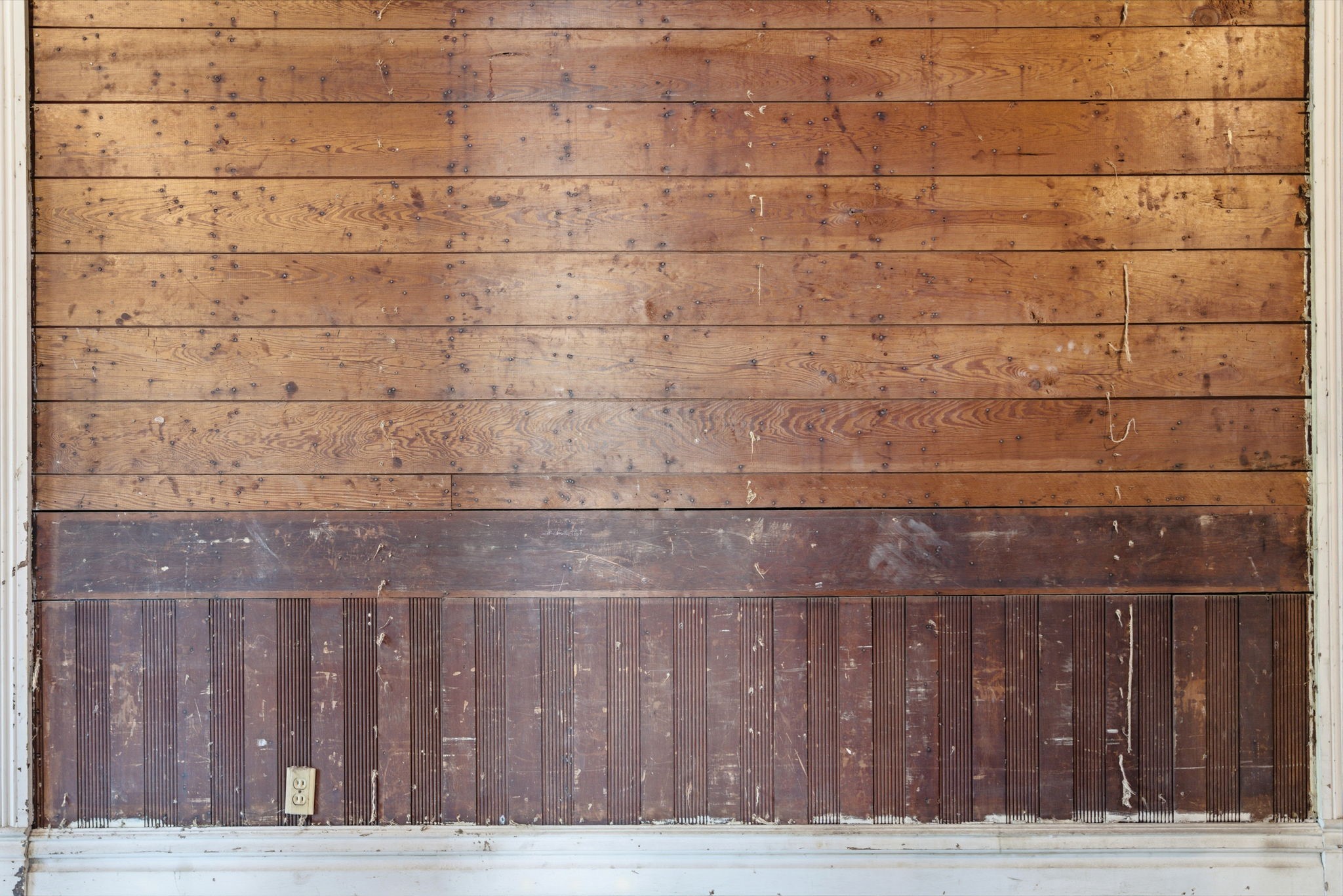 2023 Everett Street Houston, TX 77009 - Photo 8 of 25 GORGEOUS shiplap and wainscoting details in the hallway. This same wainscoting detail is also in one of the rooms!