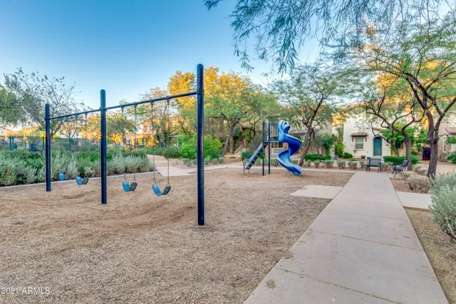 a view of a backyard with sitting area