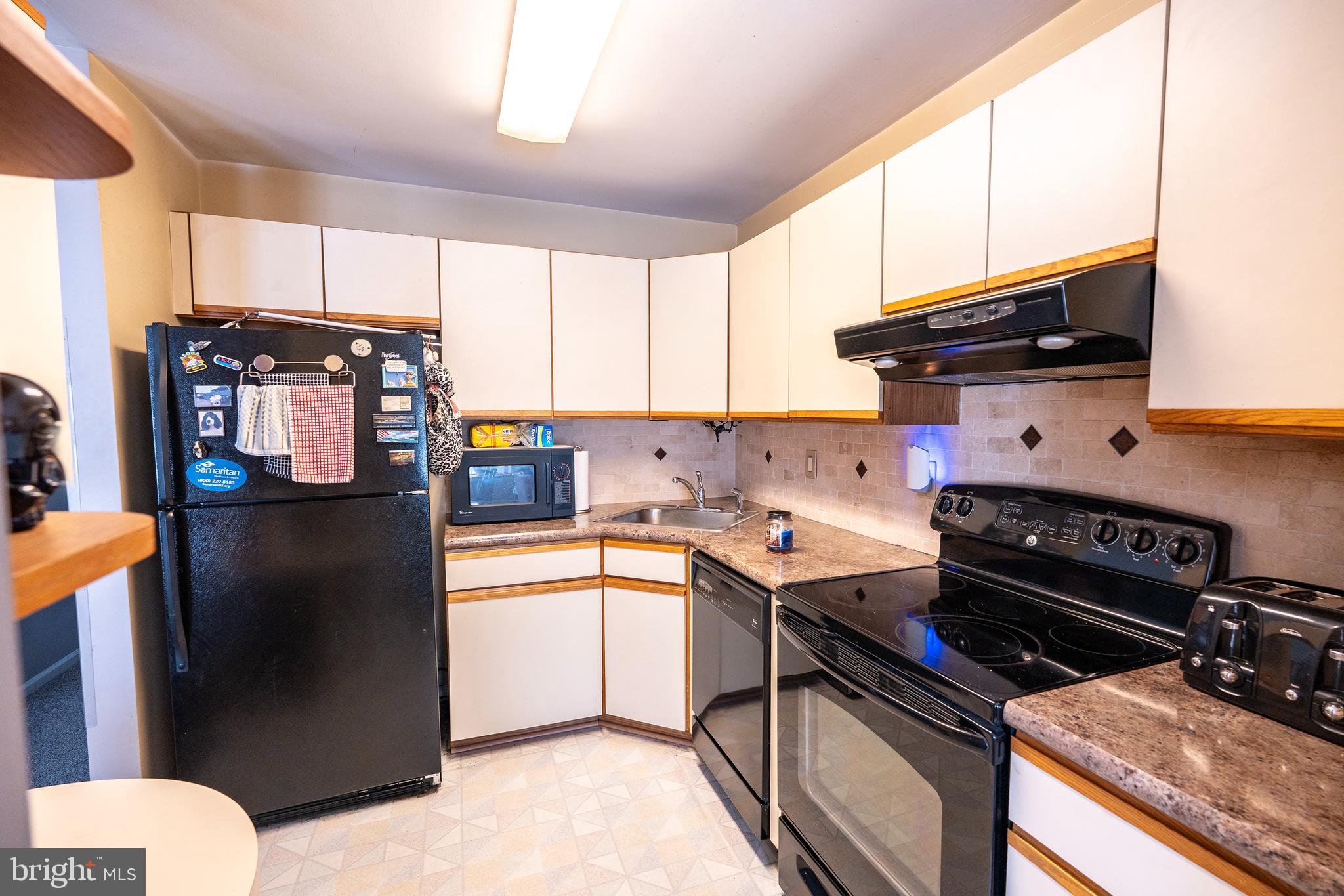44 Eraser Road Moorestown, NJ 08057 - Photo 4 of 13 a kitchen with stainless steel appliances granite countertop a refrigerator and a stove