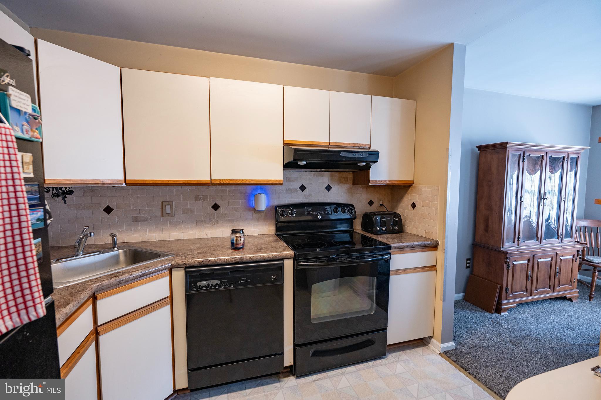 44 Eraser Road Moorestown, NJ 08057 - Photo 5 of 13 a kitchen with a sink stove and cabinets