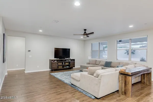 a view of a dining room with furniture and wooden floor
