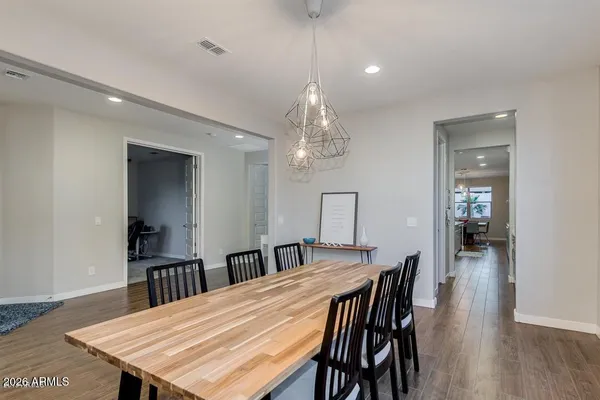 a kitchen with a stove and a wooden floor