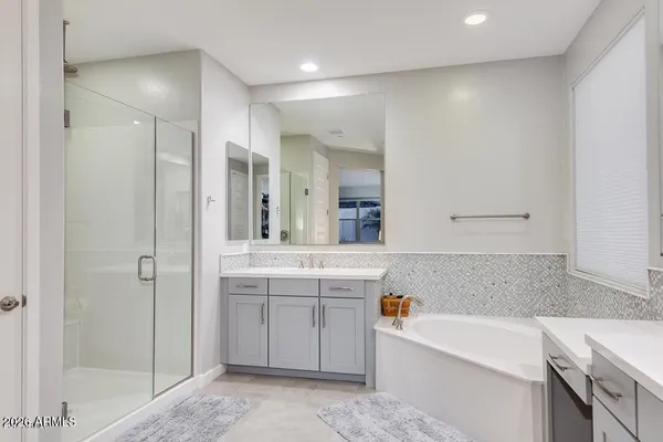 a view of walk in closet with clothes