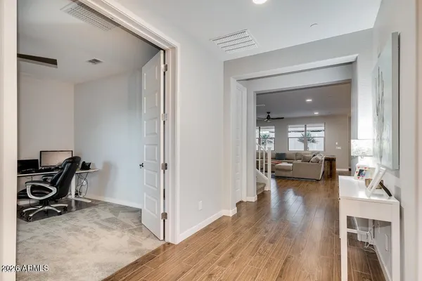 a view of a dining room with furniture and wooden floor