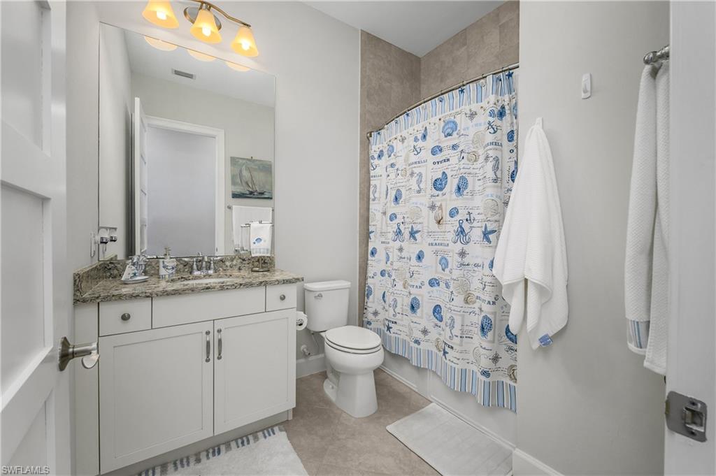 6552 Dominica Drive, Unit 101 Naples, FL 34113 - Photo 22 of 50 a bathroom with a sink toilet and shower