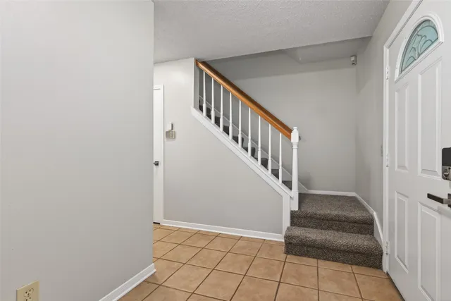 a view of an entryway with staircase