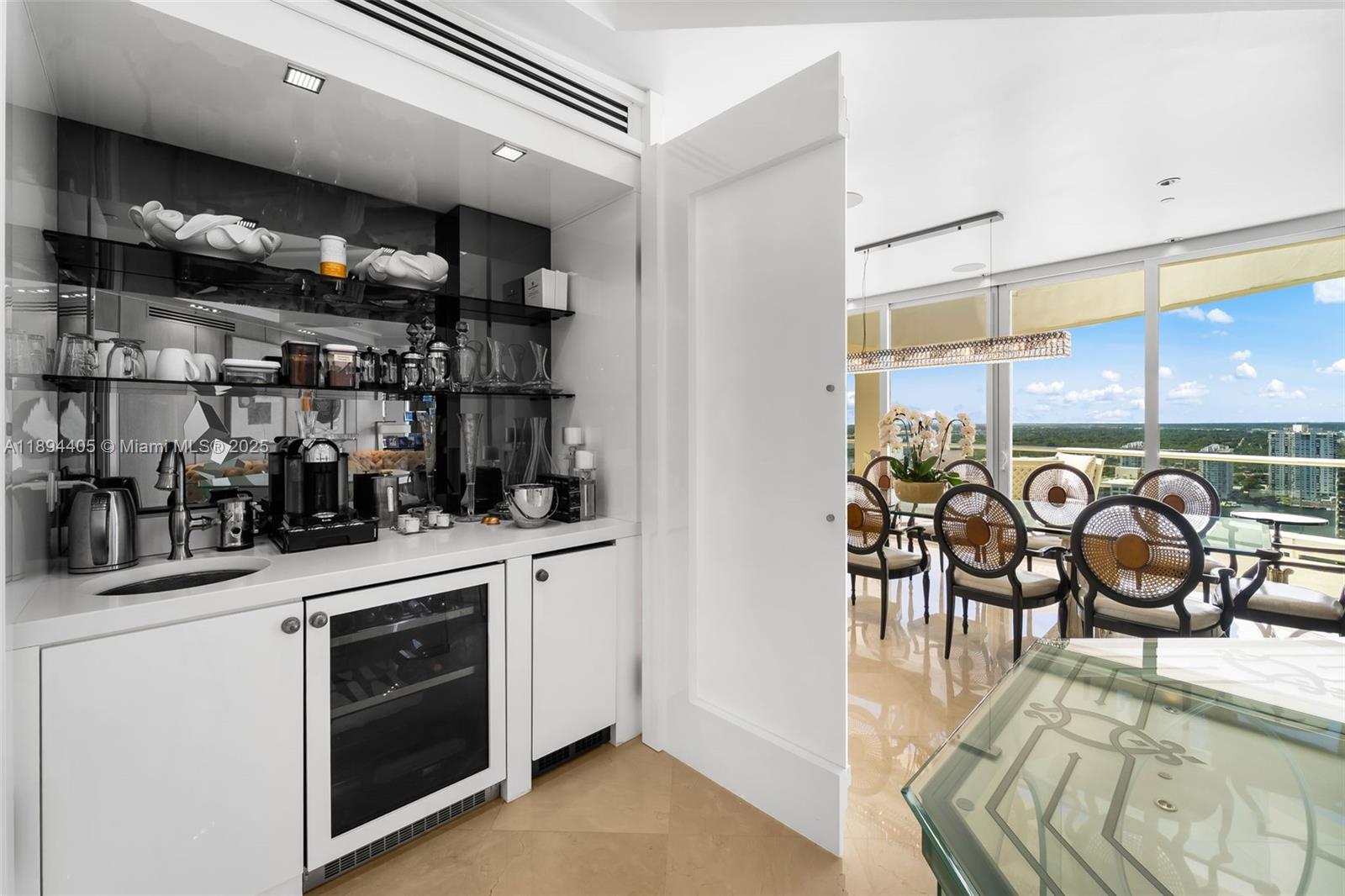 7000 Island Boulevard, Unit PH02 Aventura, FL 33160 - Photo 11 of 53 a kitchen with stainless steel appliances granite countertop a stove and a sink