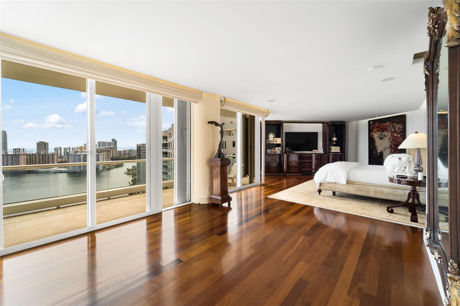 7000 Island Boulevard, Unit PH02 Aventura, FL 33160 - Photo 20 of 53 a living room with furniture floor to ceiling window and wooden floor