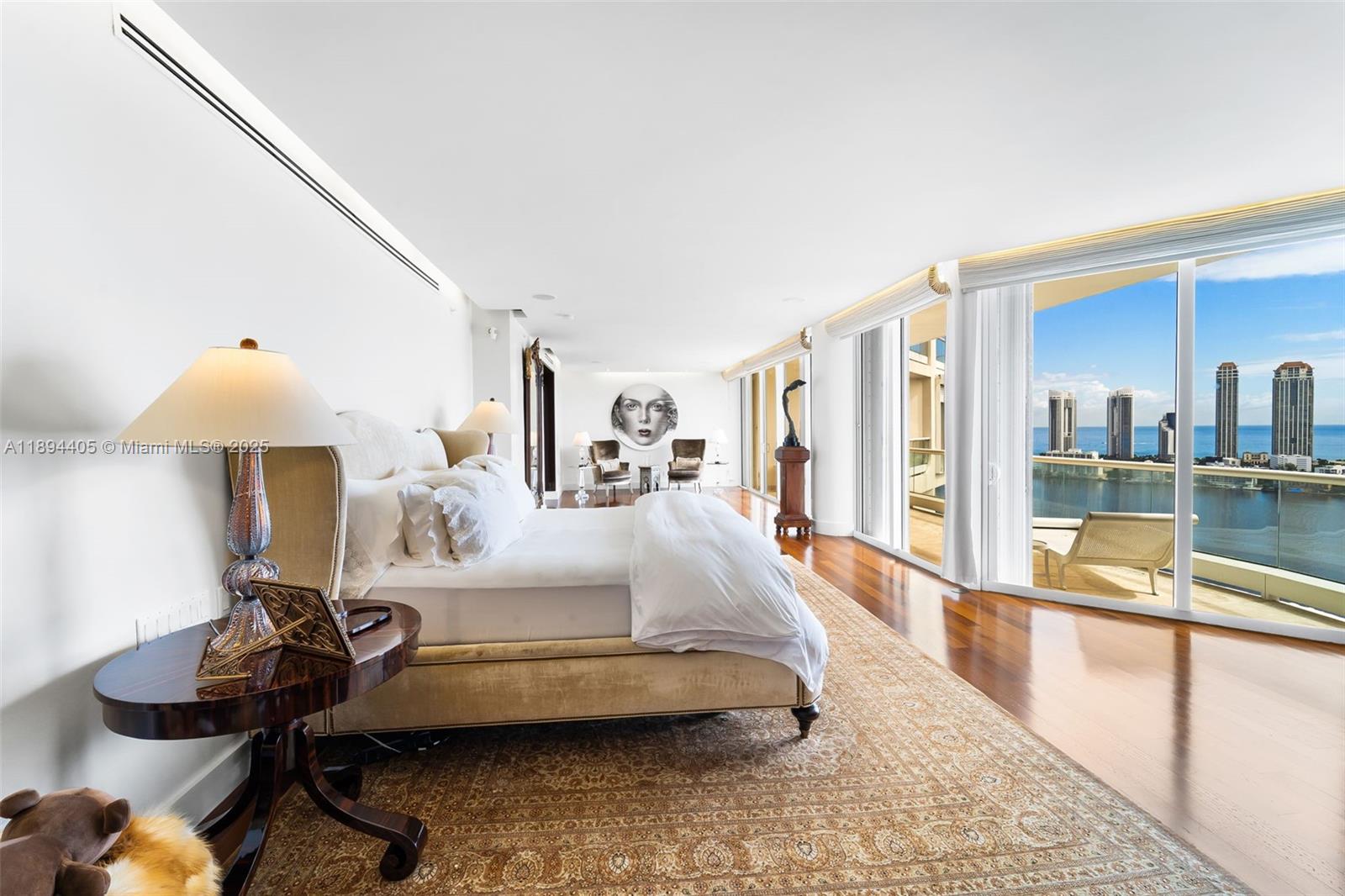 7000 Island Boulevard, Unit PH02 Aventura, FL 33160 - Photo 21 of 53 a living room with furniture and a table