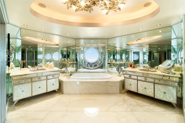 a bedroom with a bed and a lamp on table next to a window