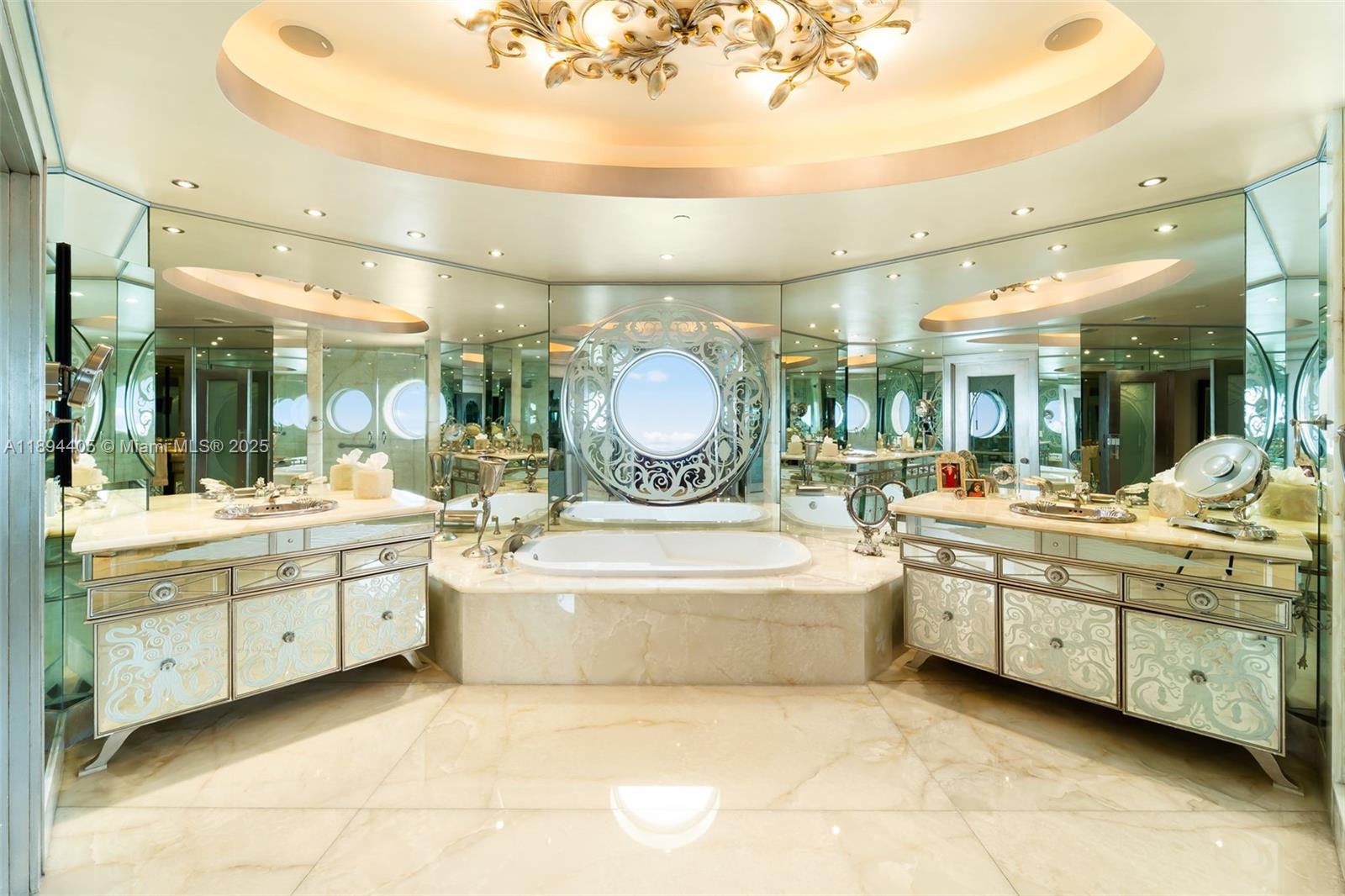 7000 Island Boulevard, Unit PH02 Aventura, FL 33160 - Photo 23 of 53 a large bathroom with a large tub and sink