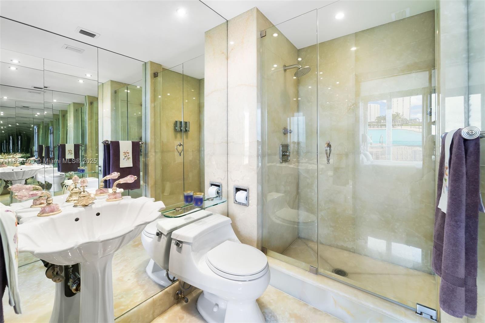 7000 Island Boulevard, Unit PH02 Aventura, FL 33160 - Photo 25 of 53 a bathroom with a sink toilet and shower