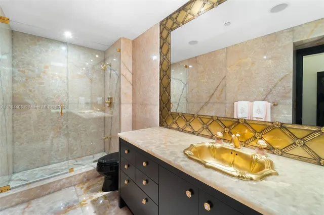 a bedroom with a bed and a flat tv screen on dresser