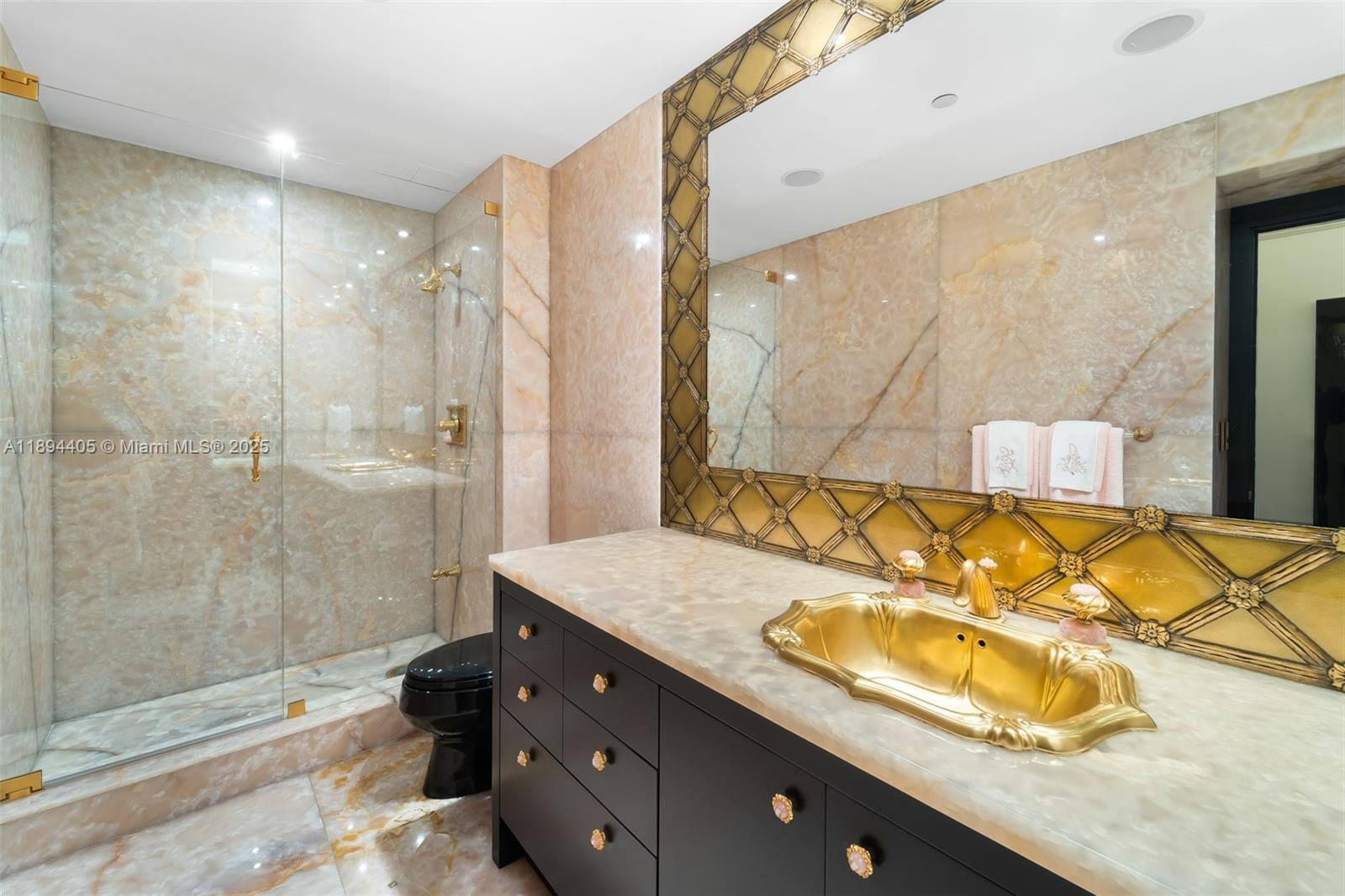 7000 Island Boulevard, Unit PH02 Aventura, FL 33160 - Photo 27 of 53 a bathroom with a granite countertop sink mirror and shower