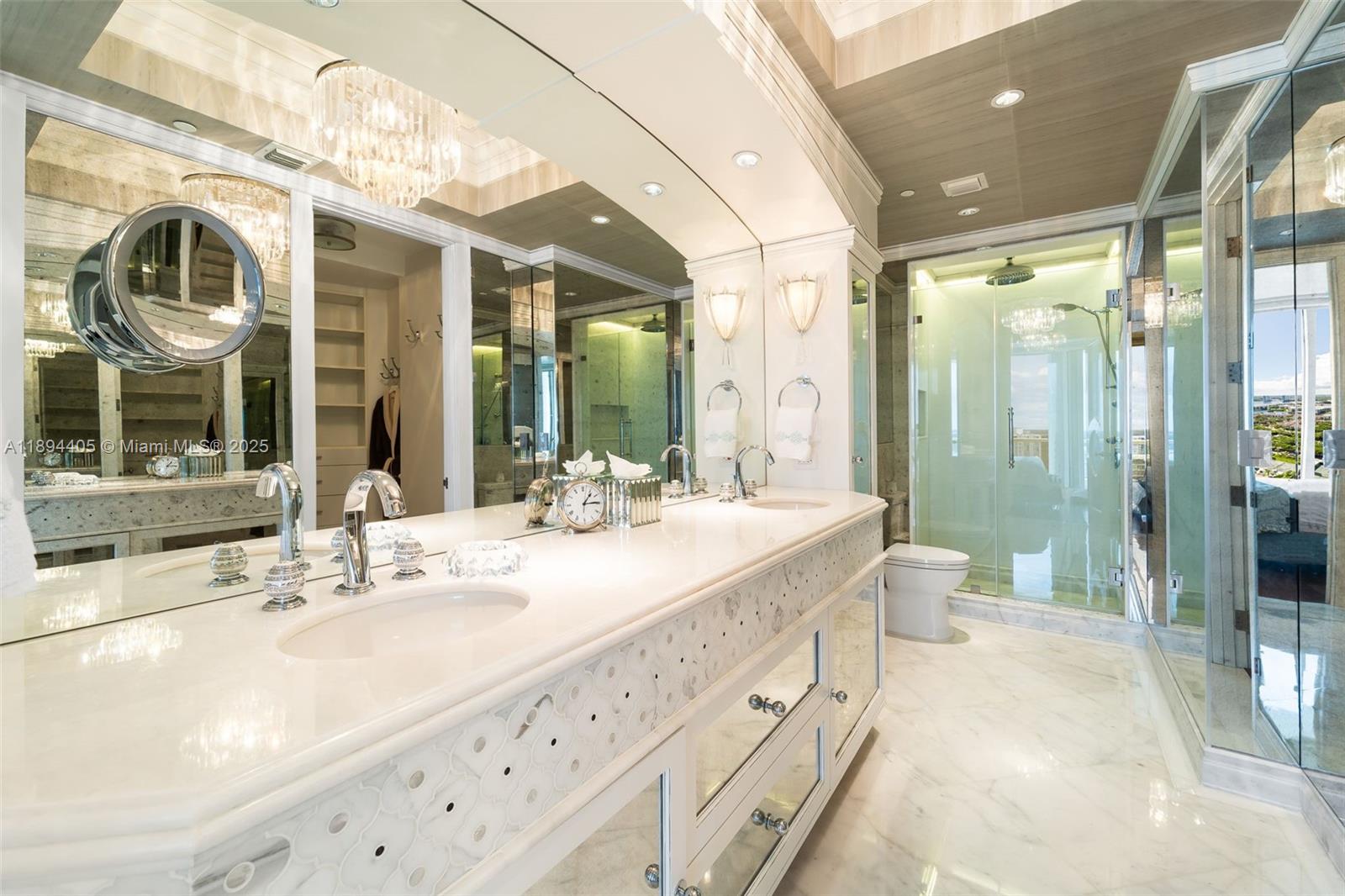 7000 Island Boulevard, Unit PH02 Aventura, FL 33160 - Photo 34 of 53 a spacious bathroom with a granite countertop sink mirror and shower