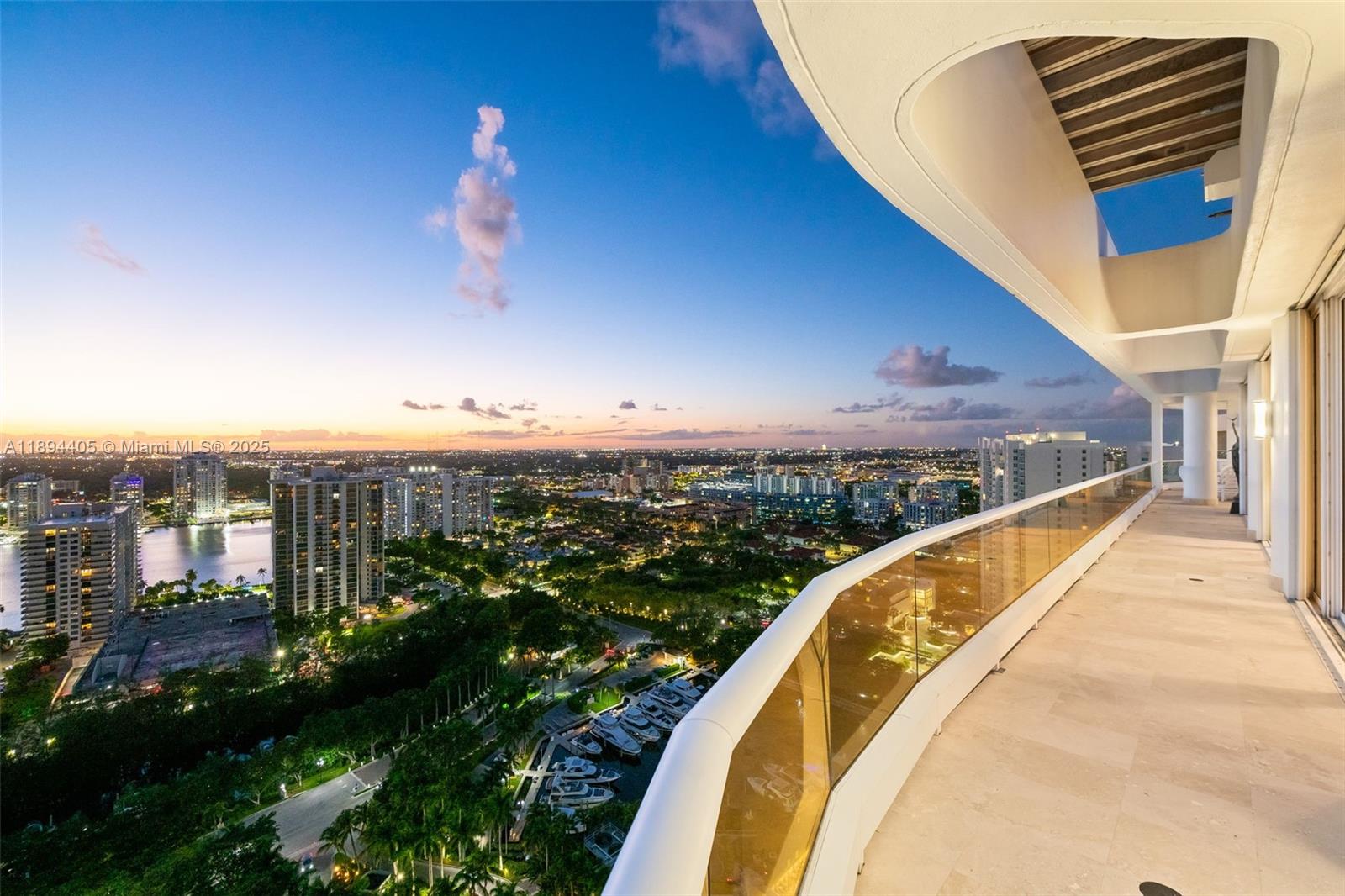 7000 Island Boulevard, Unit PH02 Aventura, FL 33160 - Photo 38 of 53 a view of a balcony with a lake