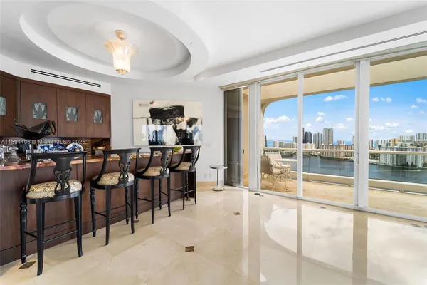 a living room with lots of furniture and a chandelier