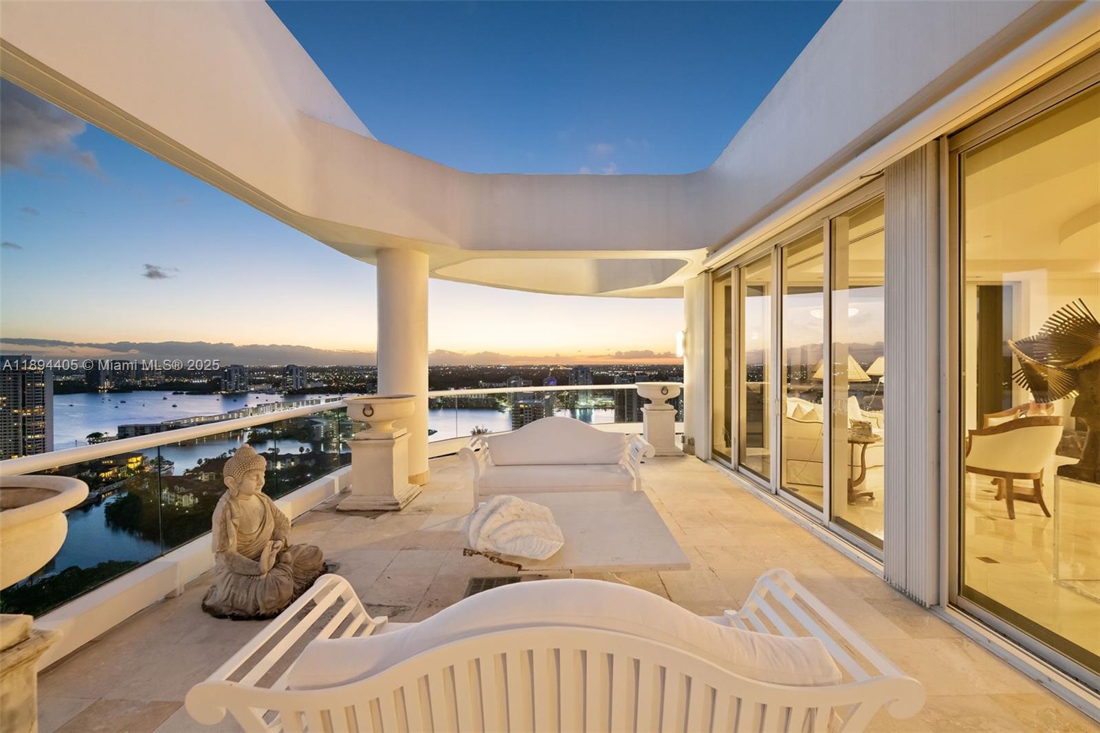 7000 Island Boulevard, Unit PH02 Aventura, FL 33160 - Photo 41 of 53 a view of a living room with furniture and floor to ceiling window