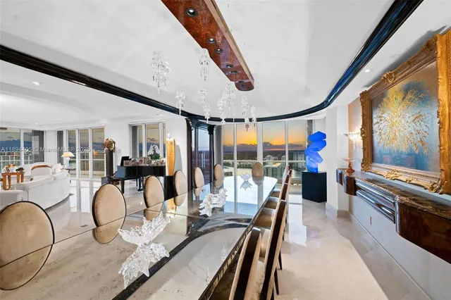 a very nice looking room with many windows and furniture