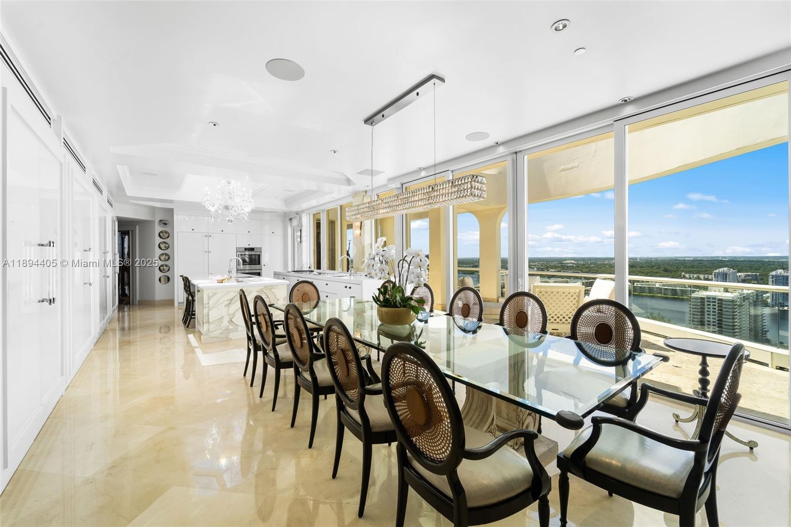 7000 Island Boulevard, Unit PH02 Aventura, FL 33160 - Photo 9 of 53 a view of a dining room with furniture window and outside view