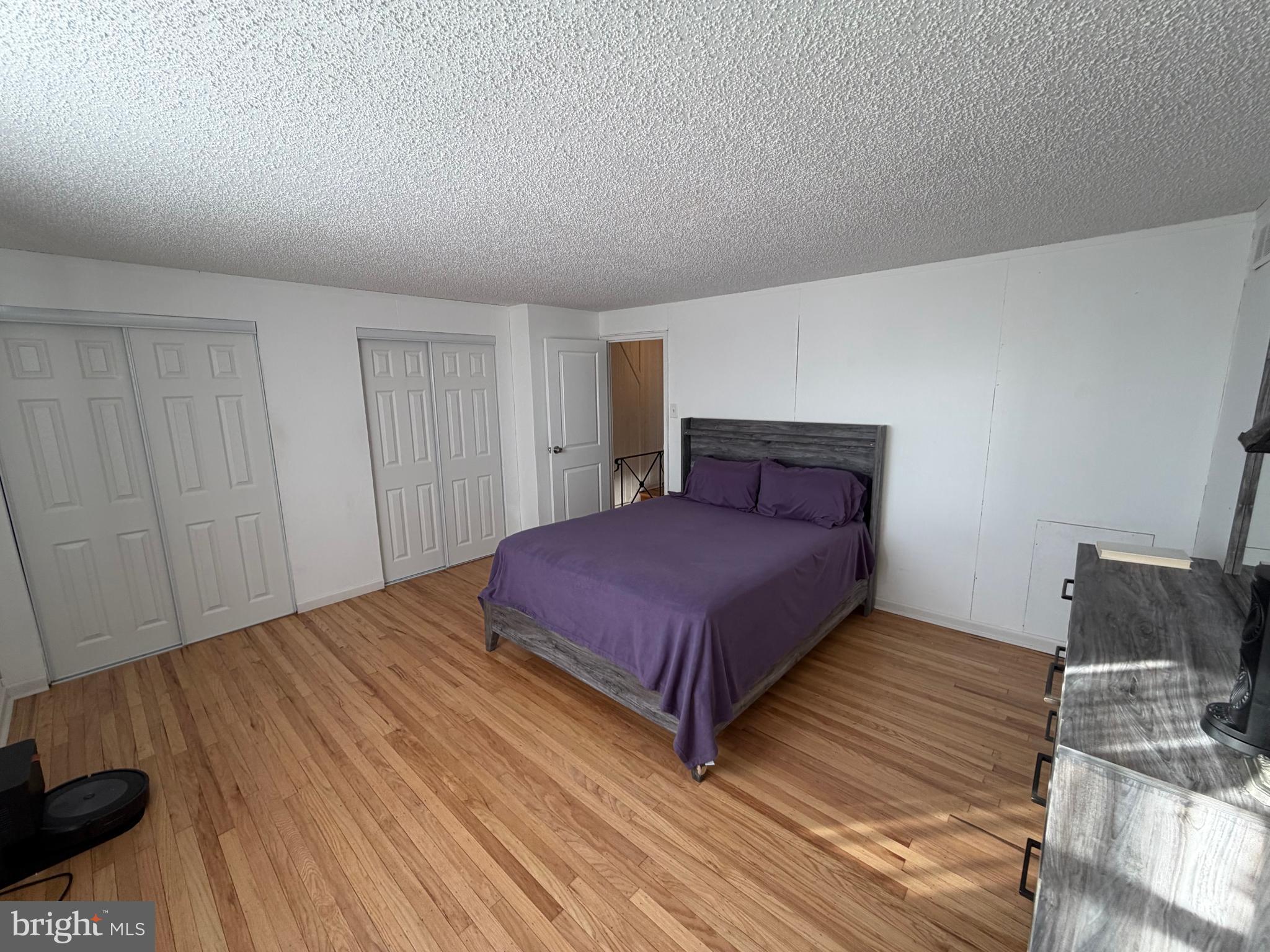 10916 Modena Place Philadelphia, PA 19154 - Photo 21 of 41 a bedroom with a bed and chair