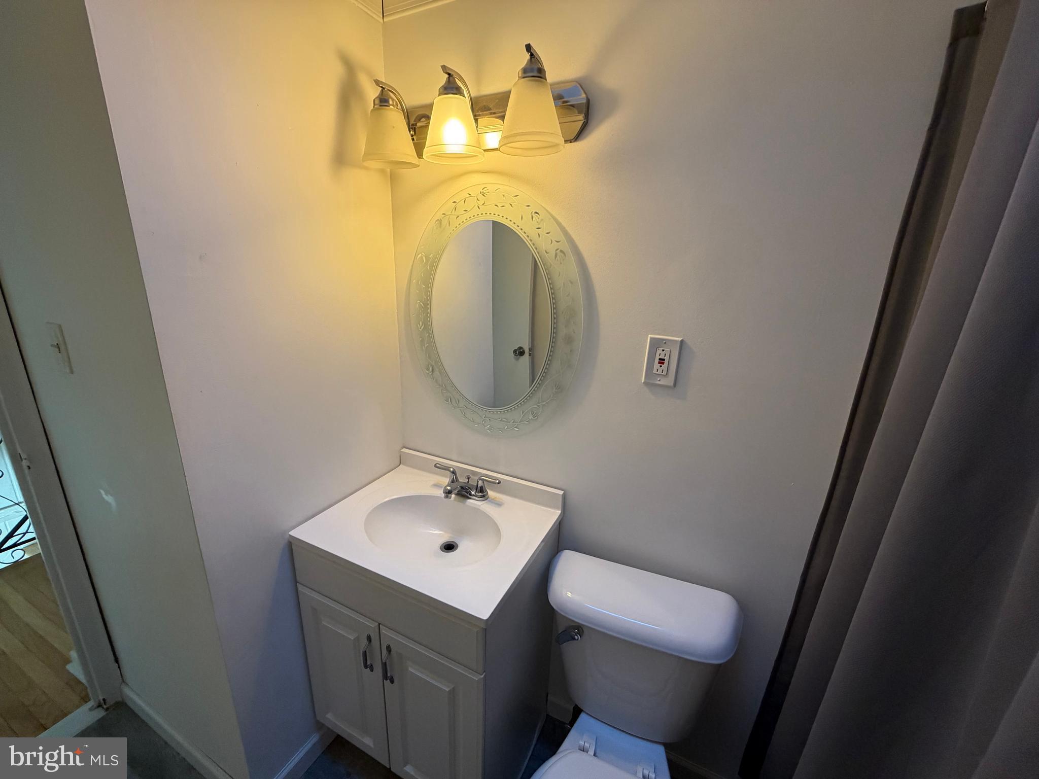 10916 Modena Place Philadelphia, PA 19154 - Photo 23 of 41 a bathroom with a sink and mirror with toilet