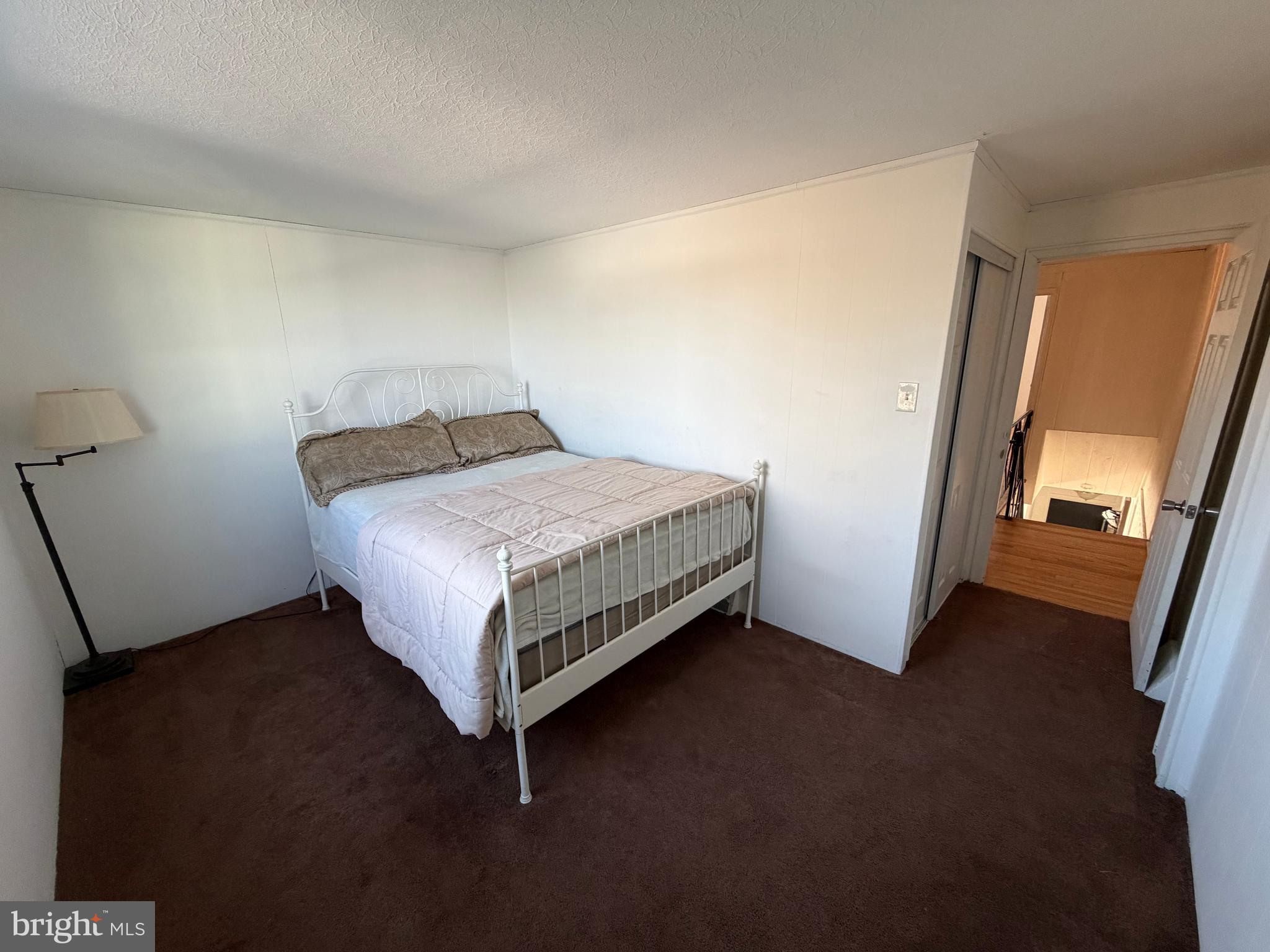 10916 Modena Place Philadelphia, PA 19154 - Photo 25 of 41 a bed sitting in a room next to a window