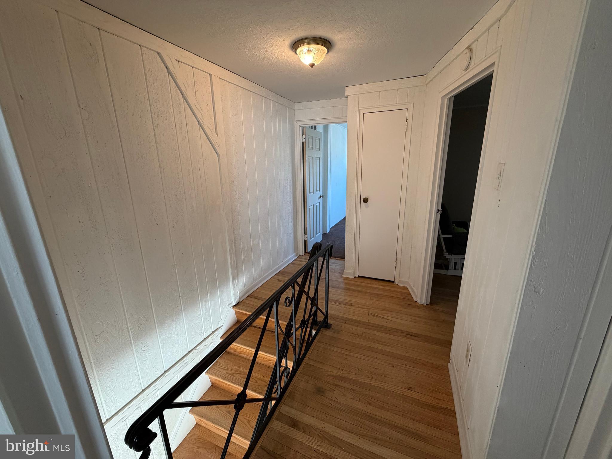 10916 Modena Place Philadelphia, PA 19154 - Photo 30 of 42 a view of a hallway with wooden floor and staircase