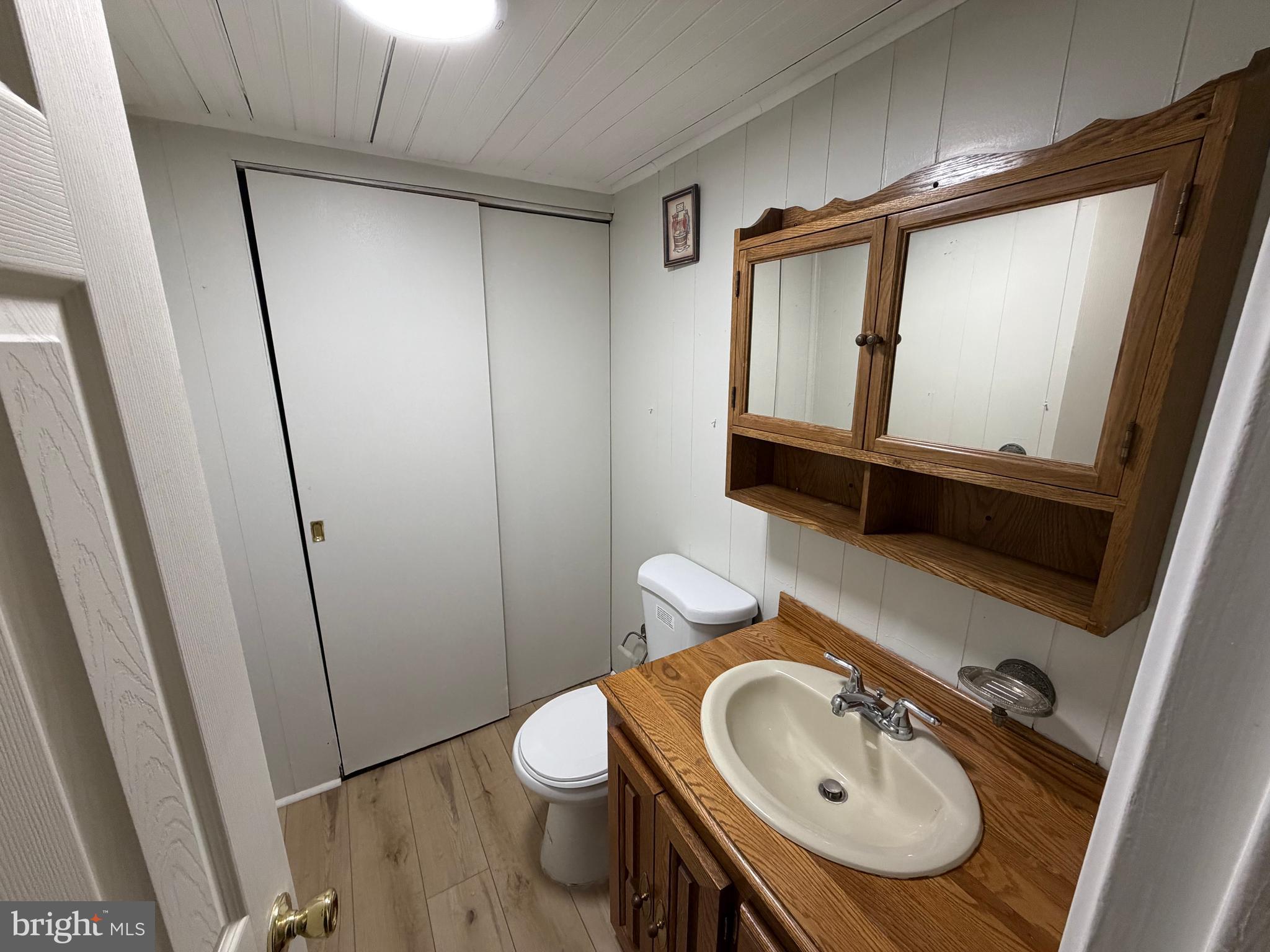 10916 Modena Place Philadelphia, PA 19154 - Photo 35 of 41 a bathroom with a sink a toilet and mirror