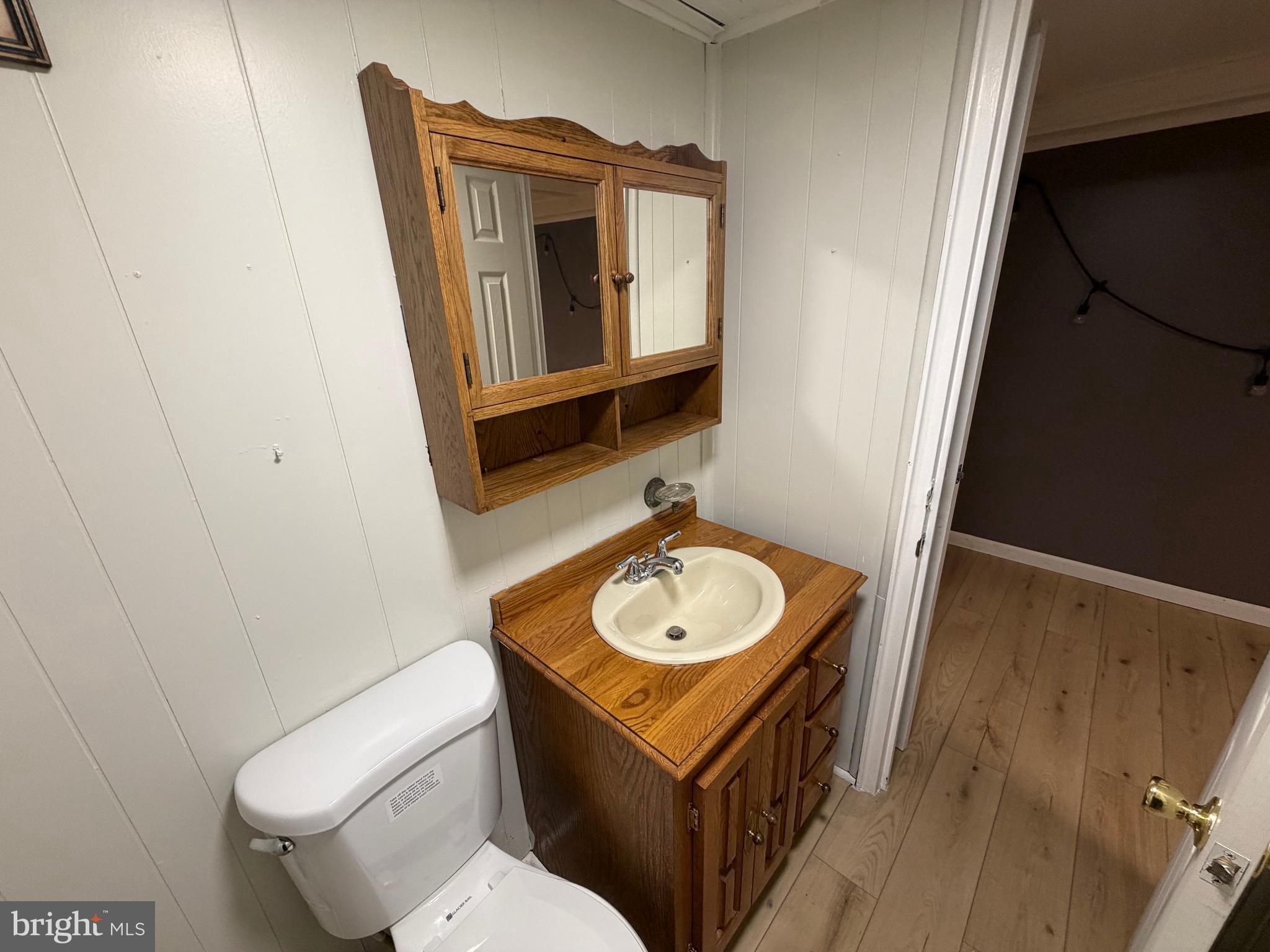 10916 Modena Place Philadelphia, PA 19154 - Photo 37 of 42 a bathroom with a toilet a sink and mirror