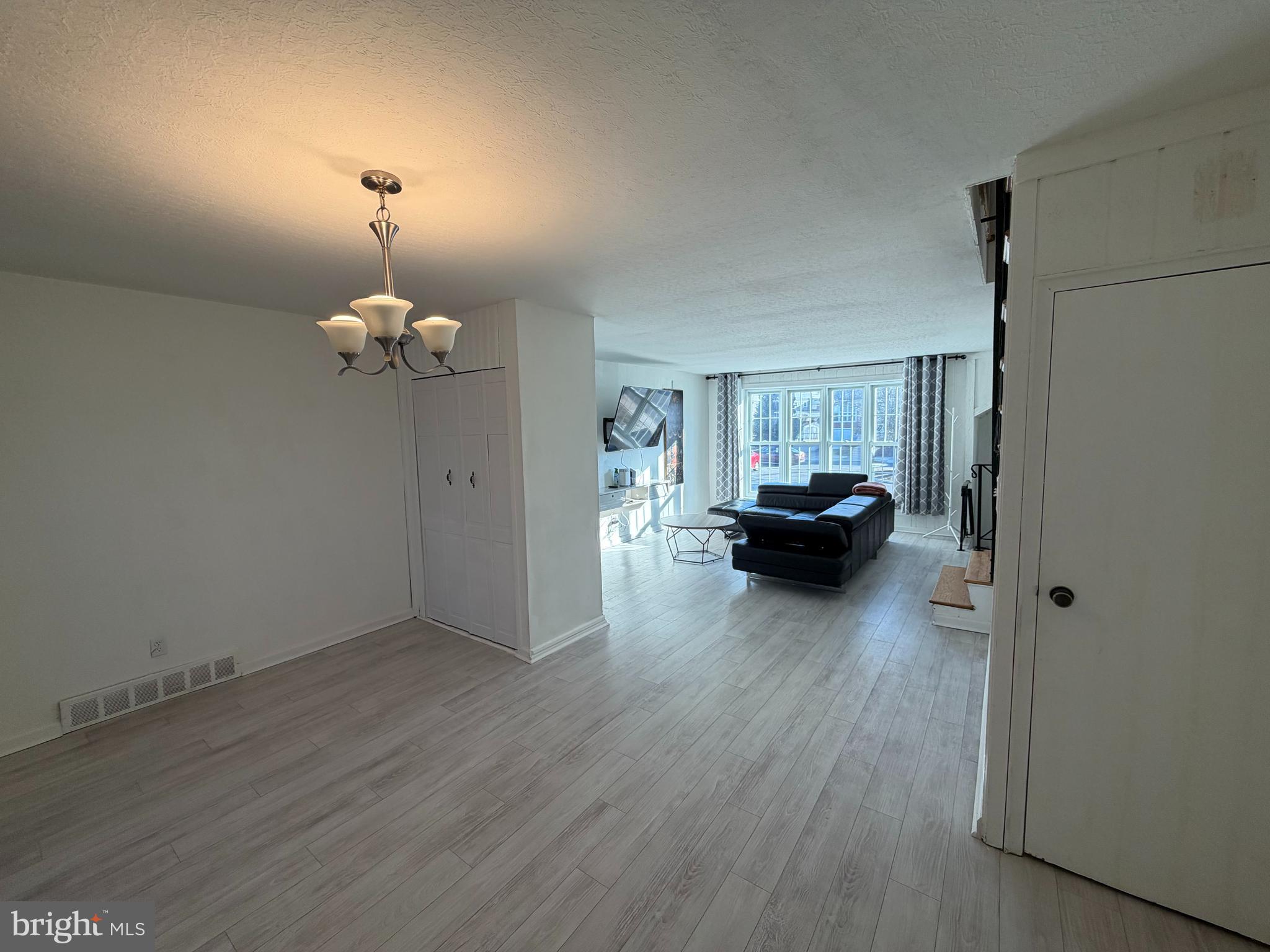 10916 Modena Place Philadelphia, PA 19154 - Photo 9 of 41 a view of livingroom with furniture wooden floor and chandelier