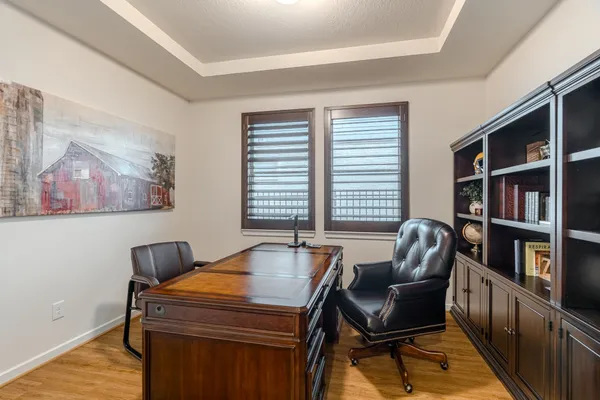 a bedroom with furniture and a book shelf