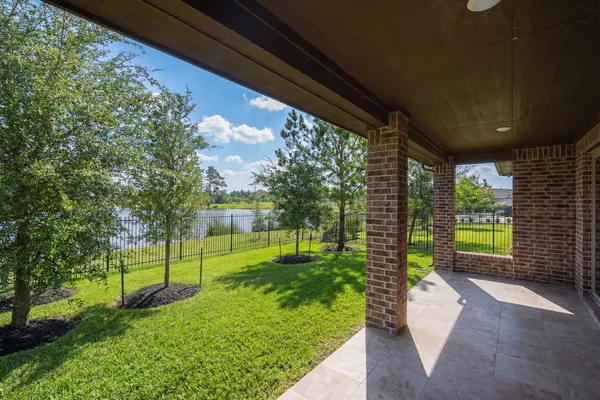 a view of a house with big yard and a garden