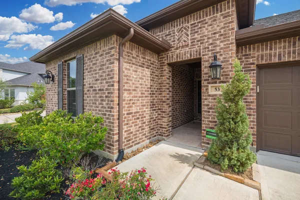 a front view of a house with a garage